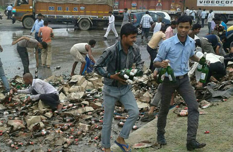 a-truck-loaded-with-cartons-of-beer-met-with-an-accident