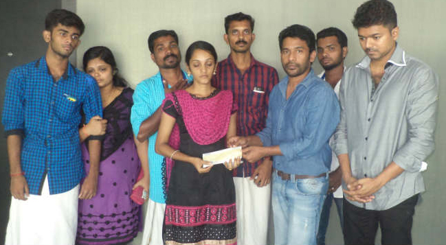 vijay-visited-unnikrishans-house-and-handing-over-a-token-amount-of-rs-3-lakhs