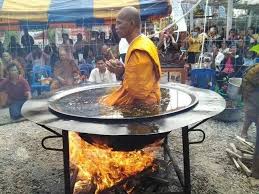 a-buddhist-monk-meditating-in-a-hot-oil-container