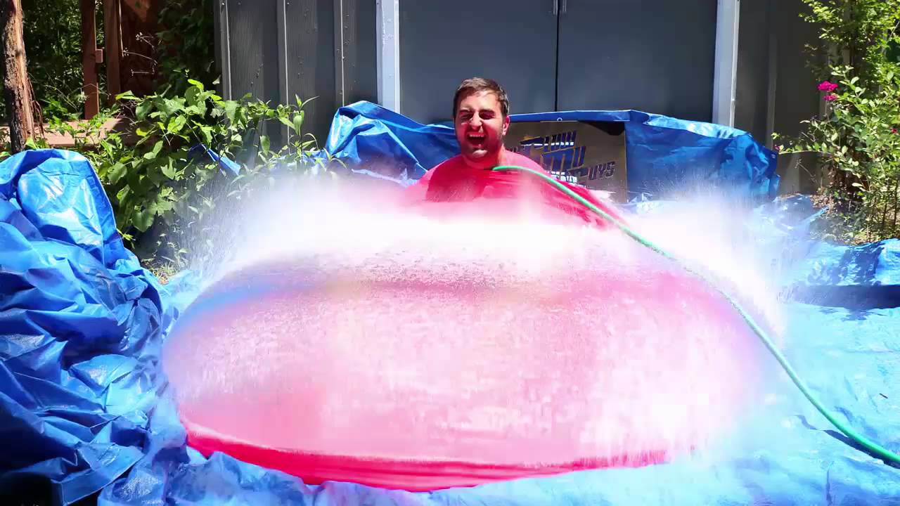 man-explodes-out-of-a-giant-water-balloon-in-glorious-slow-motion