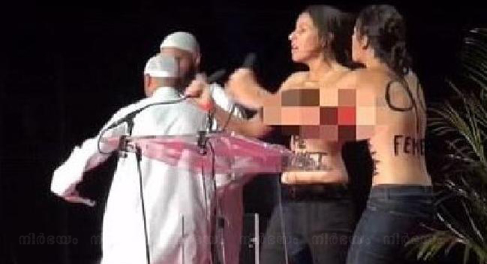topless-femen-disrupt-muslim-conference-in-france-get-kicked