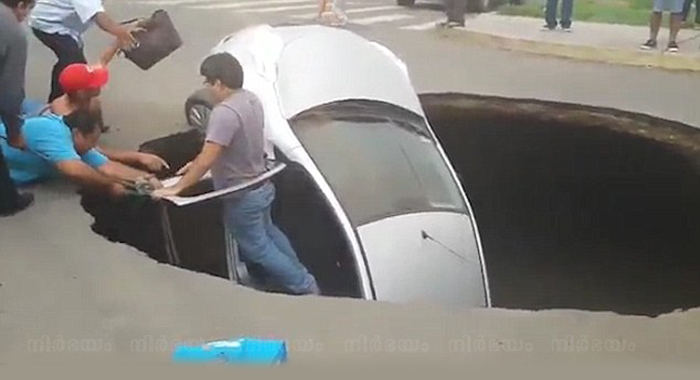 dramatic-moment-family-are-heroically-rescued-from-sinkhole
