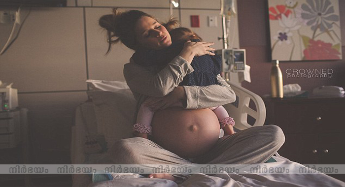 viral-picture-of-a-mum-hugging-her-daughter-goodbye-before-welcoming-another-child