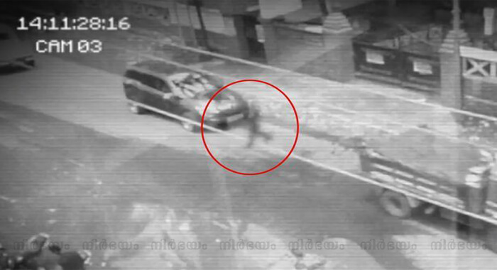 chilling-cctv-shows-ghostly-figure-walking-through-cars-on-busy-road