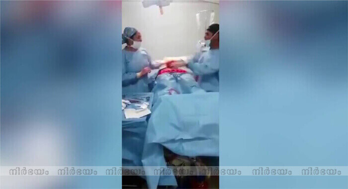 surgeon-and-nurse-dancing-during-an-operation-caught-on-camera