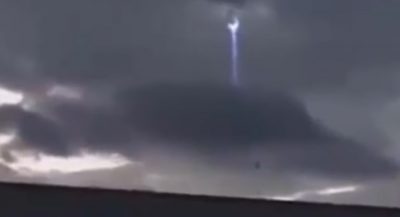 Bizarre video of a 'UFO coming to earth through a WORMHOLE'