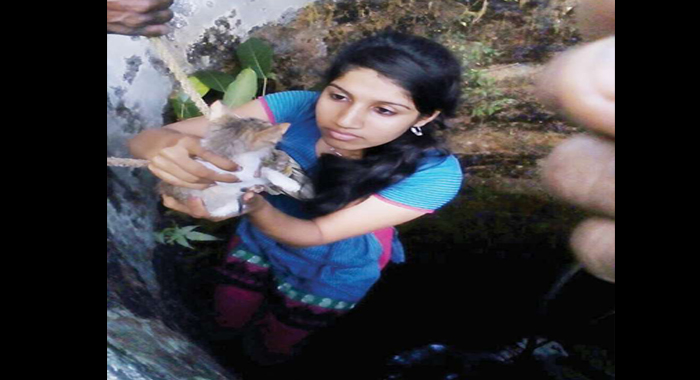 girl-saves-a-cat-from-well