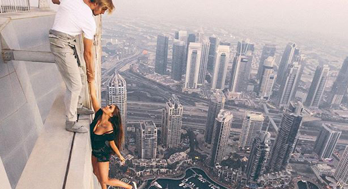 russian-model-viktoria-viki-odintcova-hangs-from-dubais-cayan-tower-instagram-photo-shoot