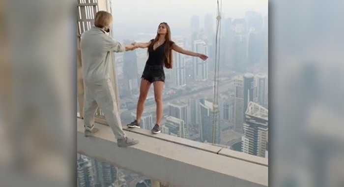 russian-model-viktoria-viki-odintcova-hangs-from-dubais-cayan-tower-instagram-photo-shoot2