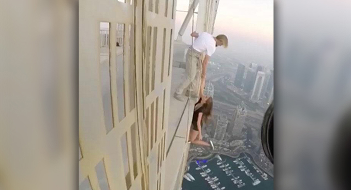 russian-model-viktoria-viki-odintcova-hangs-from-dubais-cayan-tower-instagram-photo-shoot3