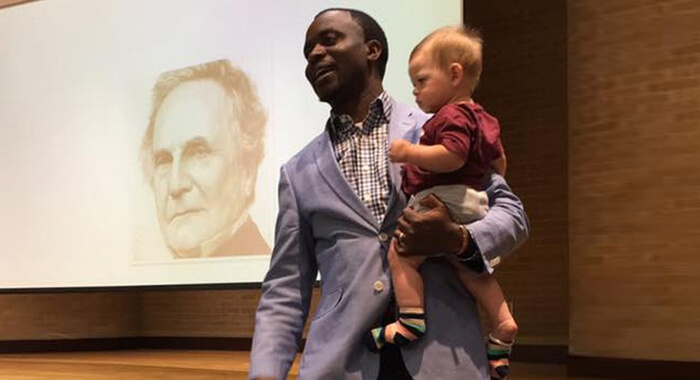 professor-holds-students-child-during-class