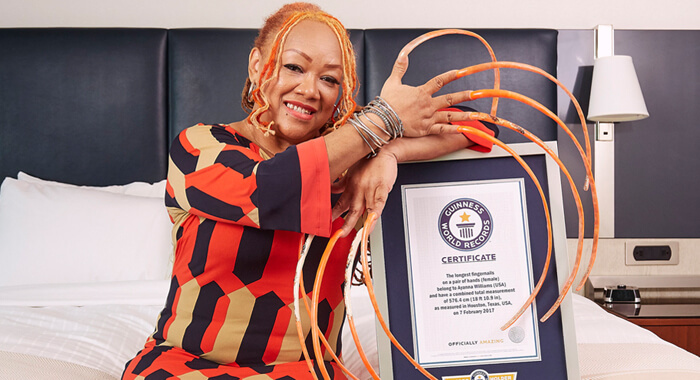 woman-breaks-world-record-for-longest-fingernails-with-total-length-over-18-feet