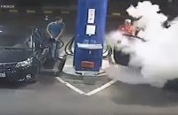 gas-station-man-smoking-cigarette-fire-extinguisher