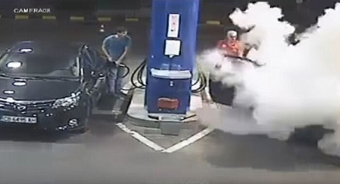 gas-station-man-smoking-cigarette-fire-extinguisher